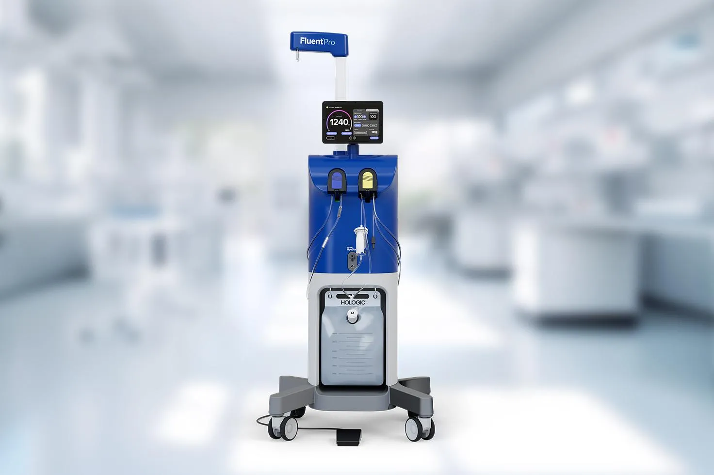 Hologic Fluent Pro Management System mot en suddig bakgrund av en operationssal.